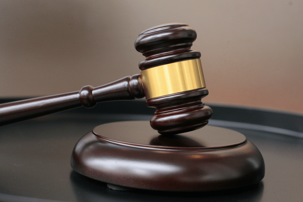 Court gavel on a sounding block